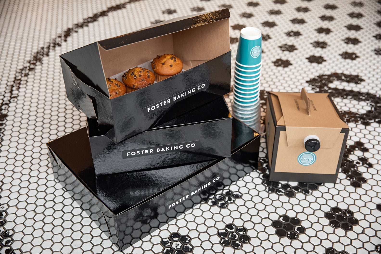 Foster Baking Co packaging with cookies and a cup on a patterned surface